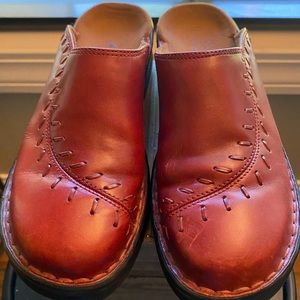 Clarks slip on mules with detailed stitching